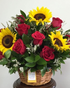 Basket of sunflowers and red roses